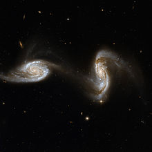 Two spiral galaxies deforming under the influence of each other's gravity