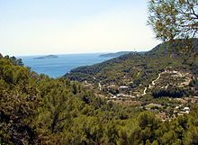 Bay of Sant Vicent. Pine forests, mountains, the sea and widely scattered fincas characterize the image of Ibiza.