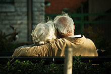 Rear view of older couple with whitened hair