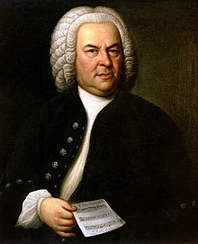Johann Sebastian Bach in 1746, met nog een van zijn composities gebaseerd op de canon: zijn canon triplex a 6 voci, BWV 1076. Olieverfschilderij door Elias Gottlob Haussmann.
