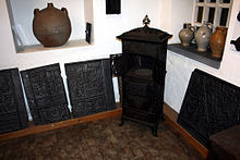 Cast-iron stove and various stove plates decorated in relief in the Eversberg local history museum