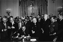 The Civil Rights Act of 1964 is signed by President Johnson in July 1964.
