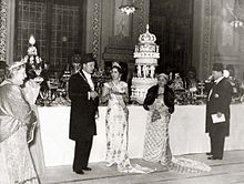 A banquet at the Abdeen Palace on the occasion of the wedding of King Faruq and Queen Farida of Egypt. People photographed from right to left: Princess Nimet Mouhtar (1876-1945), Faruq's aunt (paternal); King Faruq (1920-1965), the groom; Queen Farida (1921-1988), the bride; Melek Tourhan (1869-1956), widow of Hussein Kamil; Prince Muhammad Ali Ibrahim (1900-1977), Faruq's uncle (paternal).