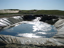 Open pit with mud created from flowback water, near the well in the Bakken Formation, North Dakota. In Germany, such open pits would not be approvable.