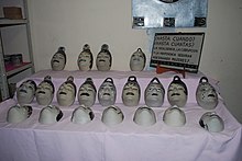 Ceramic masks in honor of the women killed in or near Ciudad Juarez.