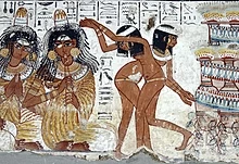 Musici en dansers, op een graftombe in Thebe, omstreeks 1400 v. Chr. De dansende vrouwen zijn naakt, de fluitspelende artiesten zien er blootsvoets uit.