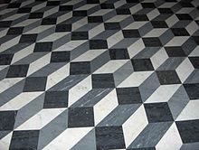 Ladrilhos na Basílica de São João de Latrão, em Roma. O padrão cria uma ilusão de caixas tridimensionais.