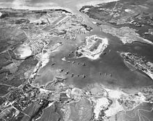 Pearl Harbor in October 1941, with Ford Island in the center and Battleship Row to the left.