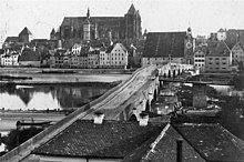 One of the oldest known photographs of Regensburg: Stone Bridge, Salzstadel and Cathedral seen from Stadtamhof (the latter still without spires) around 1860.