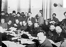 Party Congress of the Bolsheviks, with Lenin on the right. The remaining participants (from left): Yenukidze, Kalinin, Bukharin, Tomsky, Lashevich, Kamenev, Preobrazhensky, Serebryakov and Rykov in front.