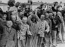 Liberated prisoners of Dachau concentration camp greet US soldiers