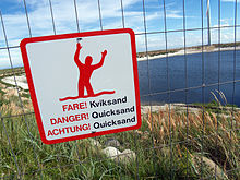 Opozorilni znak za tekoči pesek na Danskem