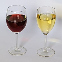 A glass of red wine and a glass of white wine