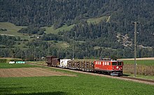 RhB freight train with a standard gauge SBB freight car