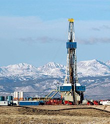 "Tight gas well in the Pinedale Anticline in the US state of Wyoming, with the Rocky Mountains in the background.