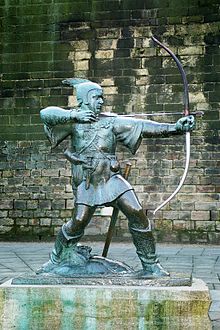 En statue af Robin Hood nær slottet i Nottingham