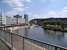 Berlin promenade on the banks of the Saar with a view of the Winterberg mountain