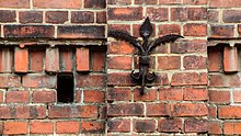 Exposed brickwork with decorative elements and brick stamps