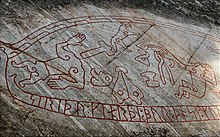 Detail of the Ramsund carving (Sweden; 11th century): Sigurd surrounded by the three sons of the sorcerer Hreidmar. The long body of the dragon Fafnir, slain by Sigurd, serves as the frame for the runic inscription. Sigurd is roasting its heart over a fire (thus gaining an understanding of the language of the birds). Ottur (or Ótr, above) was long dead at the time of the dragon fight. He is only depicted here because his death became the catalyst for the ensuing entanglements surrounding the Nibelungen hoard. The dwarf Regin (also slain by Sigurd after a warning from the birds), on the other hand, is depicted as a short-legged, bearded man surrounded by his blacksmith's tools: hammer, bellows, anvil and tongs.