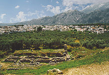 The excavated amphitheatre of ancient Sparta, the modern city in the Evrotas Valley and the Taygetos