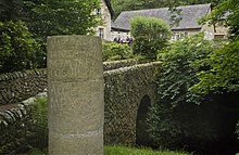 Replica of a milestone of the Stanegate road at the stone bridge over the Chainley Burn (2nd century).