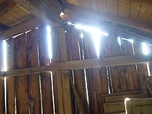 Sunlight coming through the slats of a barn