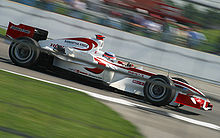 Takuma Sato med vožnjo z dirkalnikom Super Aguri na Veliki nagradi ZDA 2006.