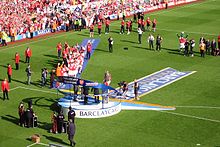 Arsenal captain Patrick Vieira lifts the championship trophy after winning the title during the 2003/04 season.