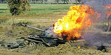 Burning Iraqi T-55 near An Nu'maniyah