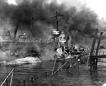 The wreck of the destroyer USS Shaw in the destroyed floating dock YFD-2