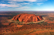 Located in the Northern Territory 340 km southwest of Alice Springs in the outback, the 348 m high island mountain Uluṟu ("Ayers Rock") -one of Australia's landmarks.