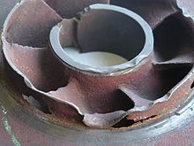 impeller of a pump worn out by cavitation
