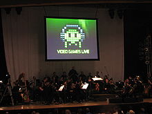 Een gepixelde alien afbeelding gebruikt op het concert evenement Video Games Live  
