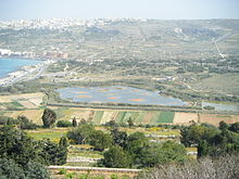 View from St. Agatha's Tower to the only nature reserve on the island, at the left edge of the picture Mellieħa Bay, behind it Mellieħa.