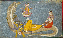 Vishnu on the serpent Shesha in the primordial sea. Consort Lakshmi massages his feet as a gesture of worship, while from his navel, seated on a lotus flower, the four-headed creator Brahma appears.