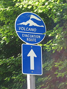 Evacuation route sign in case of volcanic eruption