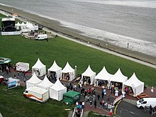 Pavilion row (below) and show stage (far left) on South Beach during Lower Saxony Day 2019.