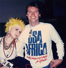 Cyndi Lauper in the studio on the day of the recording with a guest wearing the "USA for Africa" sweatshirt