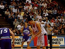 Yao in preparation for a free throw against the Utah Jazz, with John Stockton in the background (December 2002).