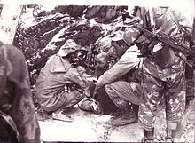 Speznas troops interrogating a captured mujahid