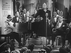 Count Basie met zijn orkest en zangeres Ethel Waters, in de film Stage Door Canteen, 1943  