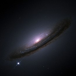 Supernova 1994D in the galaxy NGC 4526 (bright point lower left)