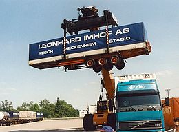 Reach stacker with raised semitrailer