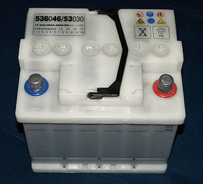 Car battery with a voltage of 12 V and capacity of 36 Ah. Earlier, open version with block lid, transparent housing, central degassing and the possibility of refilling distilled water after unscrewing the six round plugs.