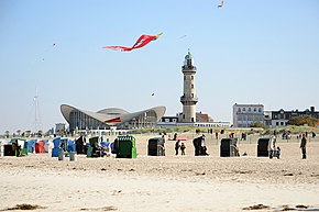Warnemünde with beach and the landmarks lighthouse and Teepott, Baltic seaside resort in the urban area of Rostock