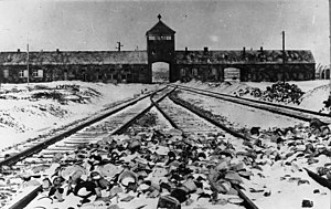 Photo of the gatehouse of the Auschwitz-Birkenau concentration camp. Taken from the train ramp inside the camp by Stanisław Mucha, February/March 1945.