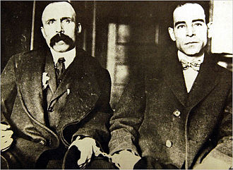 Vanzetti (left) and Sacco (right) as defendants, handcuffed to each other
