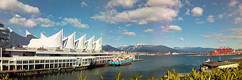 Canada Place, in the background the Burrard Inlet and the North Shore Mountains