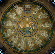 Ceiling mosaic from the Arian Baptistery in Ravenna, made during the Arian rule of the Goths. It is possible that the commissioning Arian bishops wanted to express their doctrine with some symbols: Thus, Christ is facing east, the direction opposite to that of the Christ in the older Baptistery of the Orthodox. Moreover, the shroud wrapped around the richly decorated cross is sometimes interpreted as a special emphasis on the human nature of Christ.