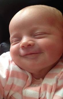 Expression of happiness in the facial expressions of a sated infant?